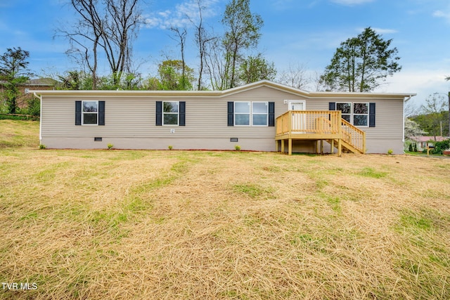exterior space featuring stairs, a deck, crawl space, and a lawn