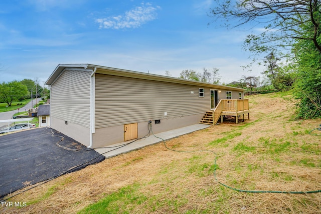 rear view of property featuring crawl space