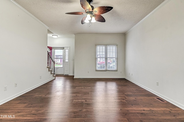 unfurnished living room with stairs, dark wood-style floors, a ceiling fan, and crown molding