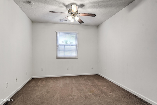 carpeted empty room featuring baseboards, a ceiling fan, and a textured ceiling