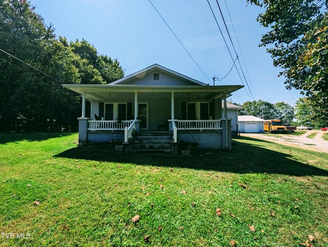 2509 Dc Caney Ridge Rd, Clintwood, VA 24228 - bungalow-style house with a front yard, covered porch, and a garage