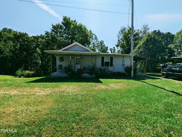 2509 Dc Caney Ridge Rd, Clintwood, VA 24228 - view of front of house with a carport, covered porch, and a front lawn