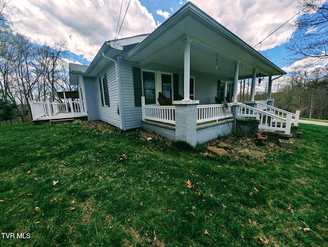 2509 Dc Caney Ridge Rd, Clintwood, VA 24228 - view of side of home featuring a porch and a yard