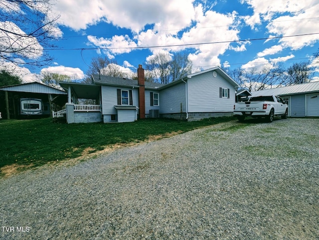 2509 Dc Caney Ridge Rd, Clintwood, VA 24228 - exterior space with driveway, a chimney, a front lawn, and covered porch