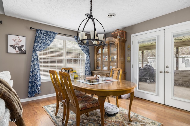 253 Crockett Dr Unit 253, Church Hill, TN 37642 - dining space with visible vents, baseboards, a notable chandelier, light wood finished floors, and french doors