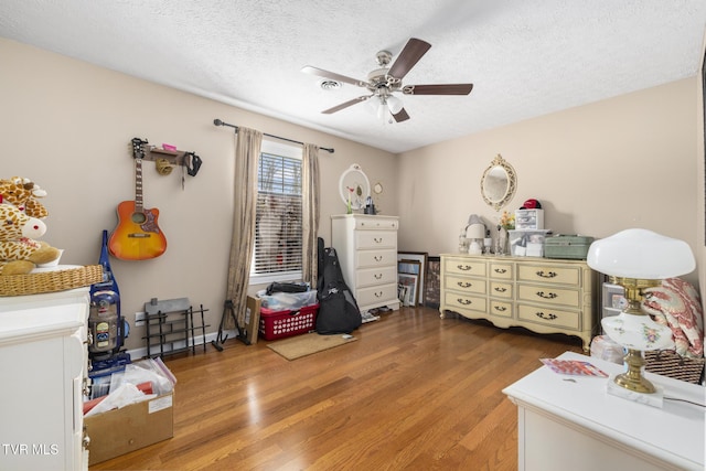 253 Crockett Dr Unit 253, Church Hill, TN 37642 - bedroom with light wood-type flooring, baseboards, a ceiling fan, and a textured ceiling