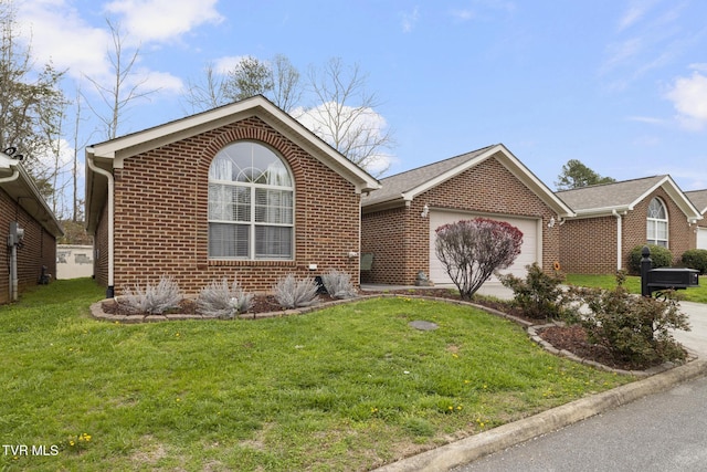 253 Crockett Dr Unit 253, Church Hill, TN 37642 - view of front of home with a garage, brick siding, driveway, and a front lawn