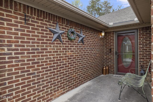 253 Crockett Dr Unit 253, Church Hill, TN 37642 - doorway to property featuring brick siding and roof with shingles