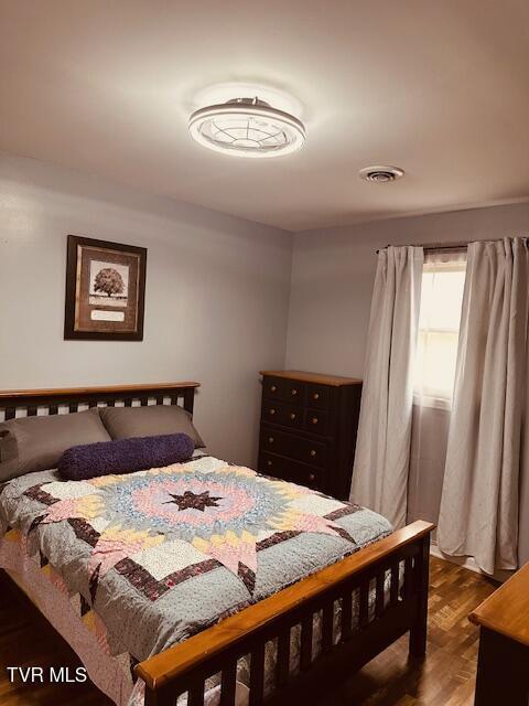 bedroom with visible vents