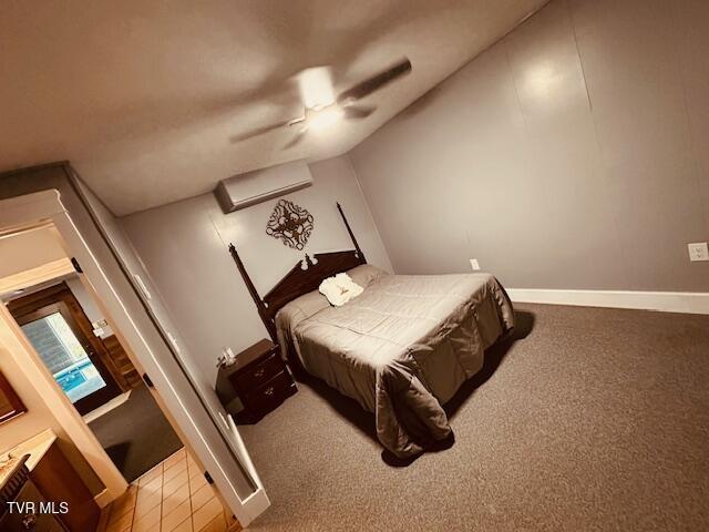 bedroom with carpet, baseboards, and a ceiling fan