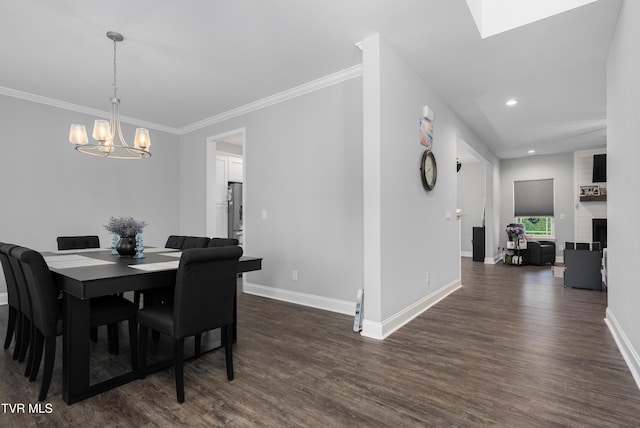 1177 Lemongrass Dr, Jonesborough, TN 37659 - dining space with crown molding, an inviting chandelier, dark wood-type flooring, recessed lighting, and baseboards