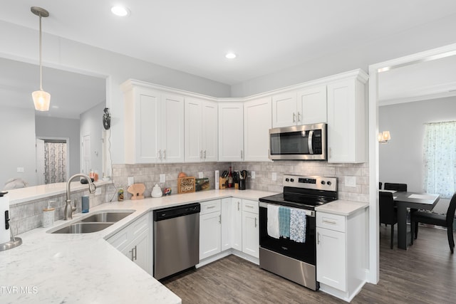 1177 Lemongrass Dr, Jonesborough, TN 37659 - kitchen featuring white cabinets, appliances with stainless steel finishes, dark wood-style flooring, a sink, and backsplash