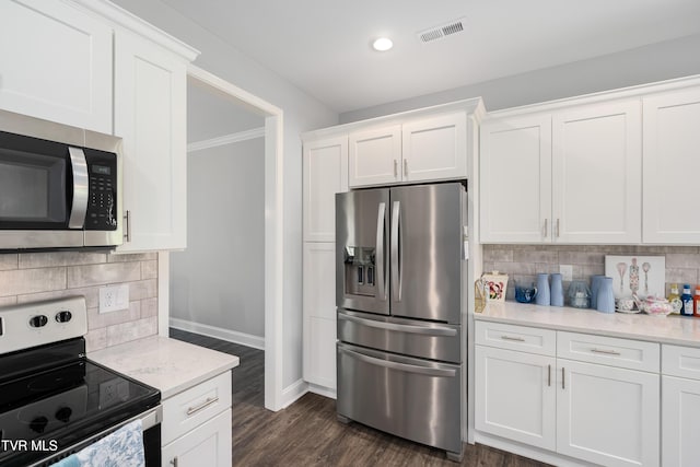 1177 Lemongrass Dr, Jonesborough, TN 37659 - kitchen with stainless steel appliances, tasteful backsplash, white cabinets, and baseboards