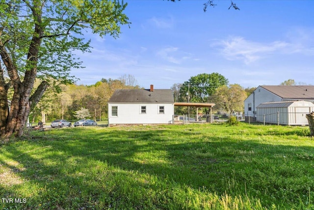 2510 Shelby St, Bristol, TN 37620 - rear view of house with a lawn, an outdoor structure, and fence