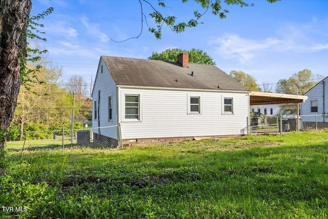 2510 Shelby St, Bristol, TN 37620 - back of house with a chimney, fence, a yard, crawl space, and a carport