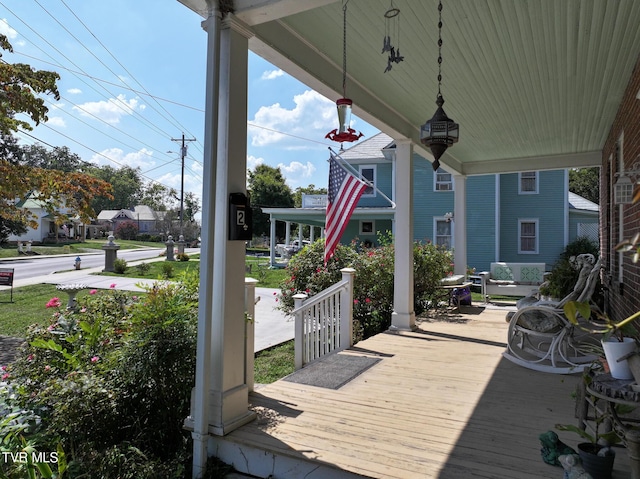 wooden terrace featuring a porch