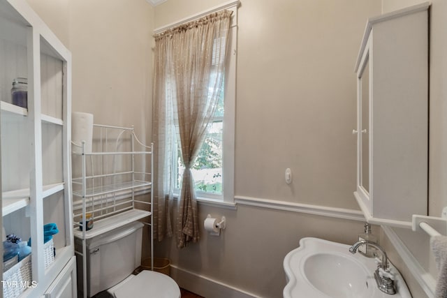 bathroom featuring toilet and a sink