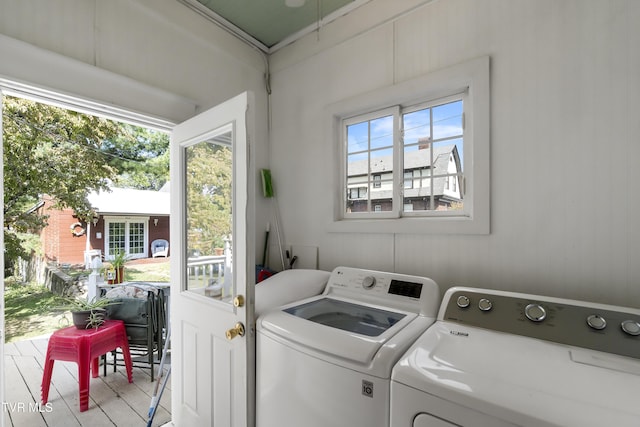 washroom featuring wood finished floors, independent washer and dryer, and laundry area