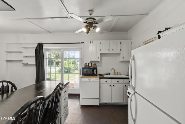 kitchen with a ceiling fan, white appliances, white cabinets, and a sink