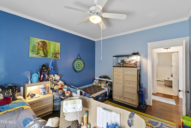bedroom featuring crown molding, ceiling fan, and wood finished floors