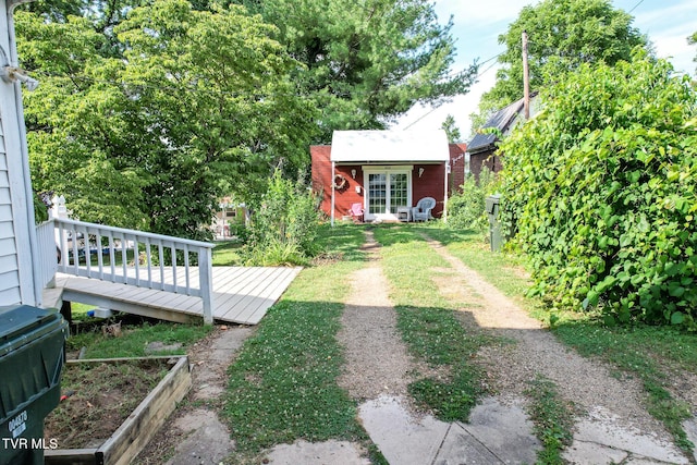 view of yard featuring a wooden deck