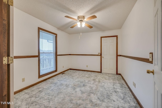 120 Lynnwood Dr, Johnson City, TN 37615 - carpeted empty room with visible vents, ceiling fan, baseboards, and a textured ceiling