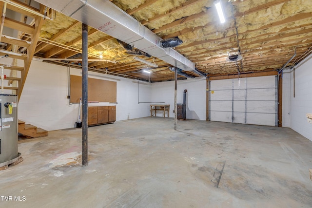 120 Lynnwood Dr, Johnson City, TN 37615 - garage featuring water heater, concrete block wall, and a garage door opener