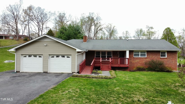 158 Taylortown Rd, Johnson City, TN 37601 - ranch-style house with aphalt driveway, a front lawn, brick siding, a chimney, and a garage