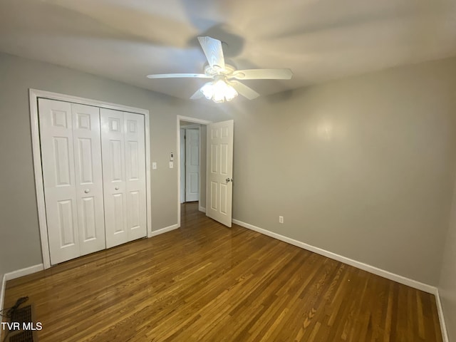 158 Taylortown Rd, Johnson City, TN 37601 - unfurnished bedroom featuring ceiling fan, a closet, baseboards, and wood finished floors