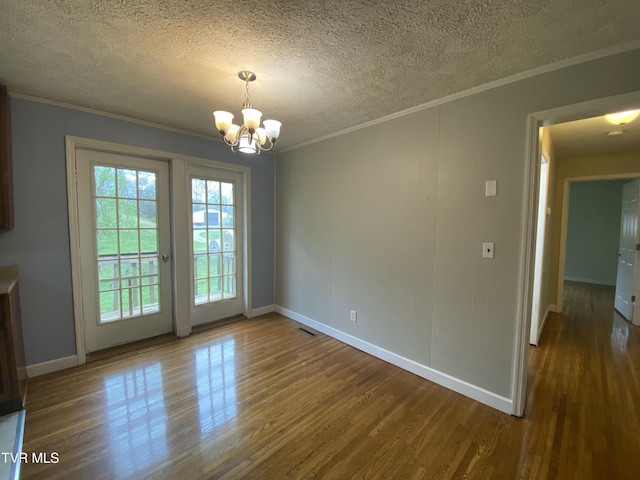 158 Taylortown Rd, Johnson City, TN 37601 - unfurnished dining area with a chandelier, crown molding, and wood finished floors