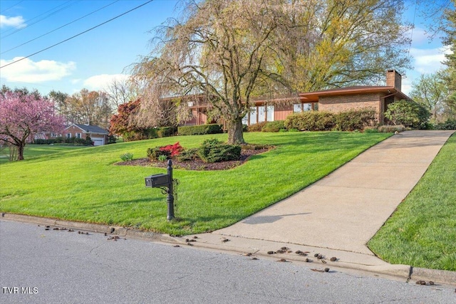 909 Millercrest Dr, Johnson City, TN 37604 - single story home with a front lawn and a chimney