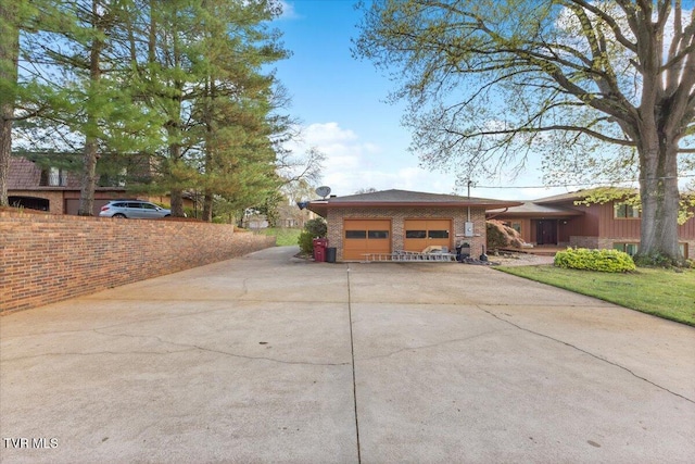 909 Millercrest Dr, Johnson City, TN 37604 - view of front of property with concrete driveway, brick siding, and an attached garage