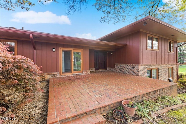 909 Millercrest Dr, Johnson City, TN 37604 - rear view of property with a patio area and brick siding
