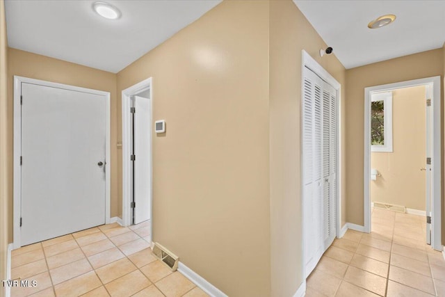 909 Millercrest Dr, Johnson City, TN 37604 - hallway featuring light tile patterned floors, baseboards, and visible vents