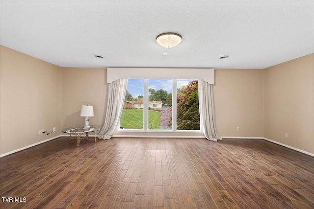 909 Millercrest Dr, Johnson City, TN 37604 - empty room featuring dark wood-style flooring and baseboards