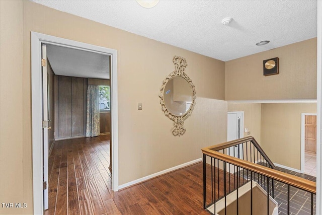 909 Millercrest Dr, Johnson City, TN 37604 - hallway featuring a textured ceiling, baseboards, an upstairs landing, and hardwood / wood-style flooring