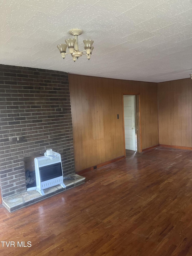 714 Fairview Ave, Kingsport, TN 37660 - interior space featuring a chandelier, a textured ceiling, heating unit, and wood finished floors