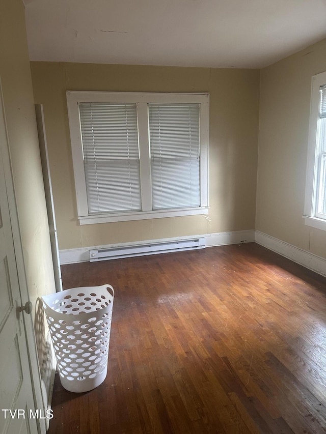 714 Fairview Ave, Kingsport, TN 37660 - spare room with baseboards, a baseboard heating unit, and wood finished floors