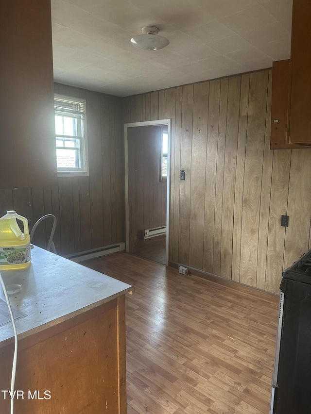 714 Fairview Ave, Kingsport, TN 37660 - kitchen featuring light wood finished floors, a baseboard heating unit, light countertops, and range with gas cooktop