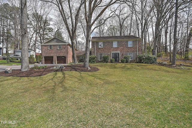 216 Forest Hills Dr, Bristol, TN 37620 - view of front of property featuring a garage, a front yard, brick siding, and driveway