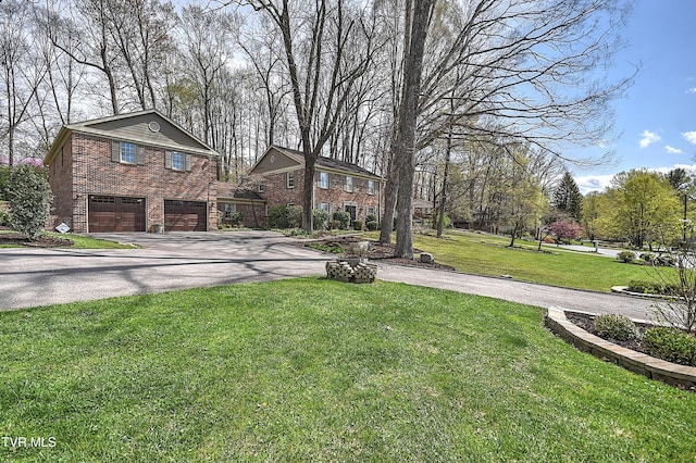 216 Forest Hills Dr, Bristol, TN 37620 - exterior space with a garage, aphalt driveway, brick siding, and a front yard