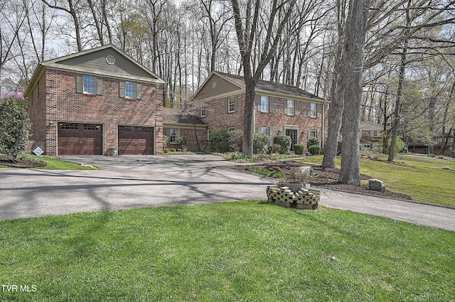 216 Forest Hills Dr, Bristol, TN 37620 - view of front facade featuring driveway, a garage, a front lawn, and brick siding