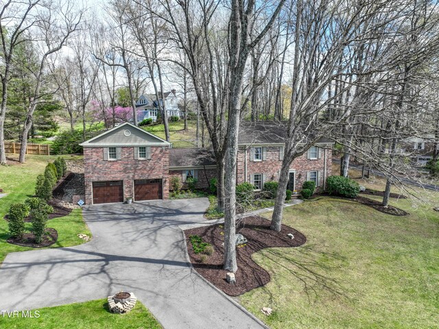 216 Forest Hills Dr, Bristol, TN 37620 - view of front of property featuring brick siding, a front lawn, a garage, and driveway