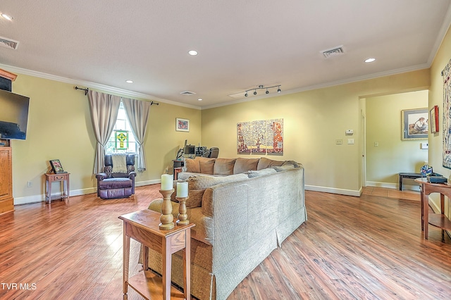 216 Forest Hills Dr, Bristol, TN 37620 - living area with crown molding, light wood finished floors, baseboards, and visible vents