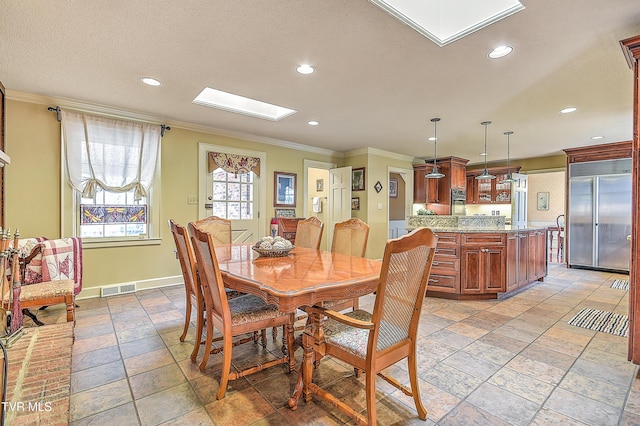 216 Forest Hills Dr, Bristol, TN 37620 - dining area with recessed lighting, visible vents, crown molding, and a skylight