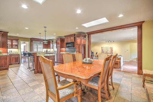 216 Forest Hills Dr, Bristol, TN 37620 - dining room with a skylight, crown molding, baseboards, and recessed lighting