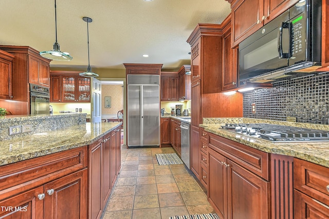 216 Forest Hills Dr, Bristol, TN 37620 - kitchen featuring light stone countertops, tasteful backsplash, black appliances, recessed lighting, and decorative light fixtures
