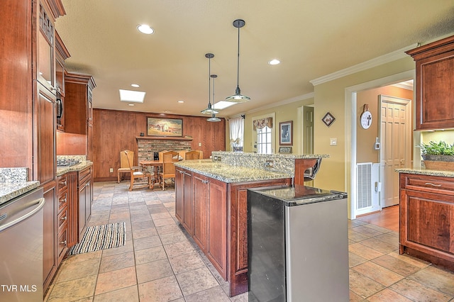 216 Forest Hills Dr, Bristol, TN 37620 - kitchen with visible vents, decorative light fixtures, ornamental molding, appliances with stainless steel finishes, and a kitchen island