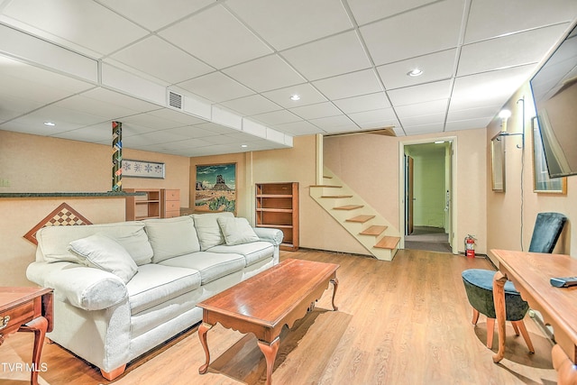 216 Forest Hills Dr, Bristol, TN 37620 - living area with visible vents, recessed lighting, stairway, wood finished floors, and a drop ceiling