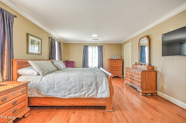 216 Forest Hills Dr, Bristol, TN 37620 - bedroom with crown molding, light wood-style flooring, and a textured ceiling